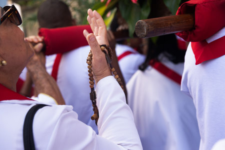 Salvador, Bahia, Brazil - July 27, 2024: Catholic faithful are seen carrying a float and an image of Jesus Christ on the steps of the Church of the Holy Sacrament of Passo, Pelourinho, Bahia.のeditorial素材