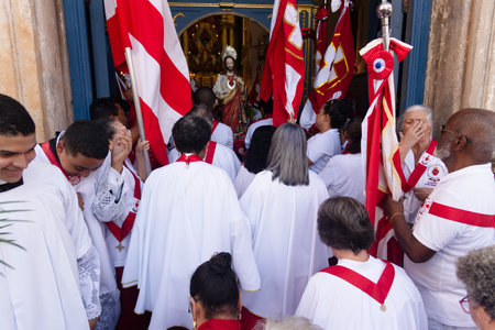 Salvador, Bahia, Brazil - July 27, 2024: Catholic procession through the streets of Pelourinho arrives at the Church of the Holy Sacrament of Passo in the city of Salvador, Bahia.のeditorial素材