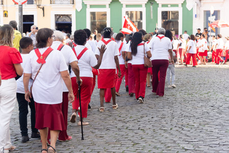 Salvador, Bahia, Brazil - July 27, 2024: Catholic faithful are seen praying and singing in the procession of the Sacred Heart of Jesus through the streets of Pelourinho, in Bahia.のeditorial素材