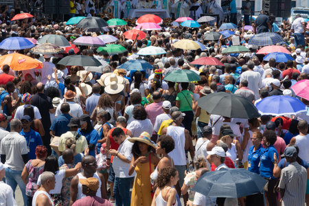 Salvador, Bahia, Brazil - December 08, 2019: People who are members of the Catholic church are seen attending an open-air mass at the Conceicao da Praia church in the city of Salvador, Brazil.のeditorial素材