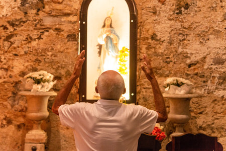 Salvador, Bahia, Brazil - December 08, 2019: Catholic faithful are seen praying inside the Conceicao da Praia church in the city of Salvador, Bahia.のeditorial素材