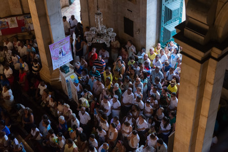 Salvador, Bahia, Brazil - December 08, 2019: Catholic faithful are seen praying inside the Conceicao da Praia church in the city of Salvador, Bahia.のeditorial素材