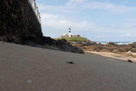 Salvador, Bahia, Brazil - September 01, 2024: Low view of the Barra Lighthouse, during a cloudy day, located in the Barra neighborhood in the city of Salvador, Bahia.のeditorial素材