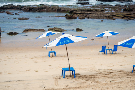 Salvador, Bahia, Brazil - September 01, 2024: Empty umbrellas on the edge of Farol da Barra beach in the city of Salvador, Bahia.のeditorial素材
