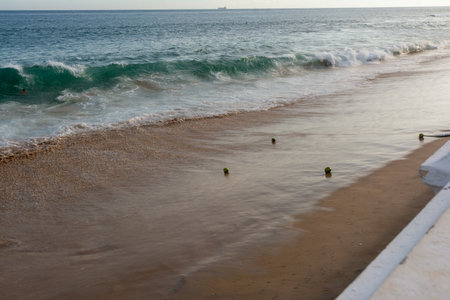 Strong sea waves breaking on the beach sand. Live nature. Environment. Brazil.の写真素材