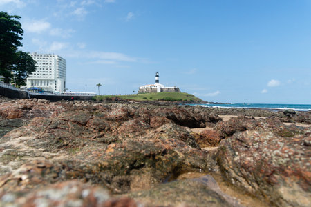 Salvador, Bahia, Brazil - September 01, 2024: Low view of the Barra Lighthouse, during a cloudy day, located in the Barra neighborhood in the city of Salvador, Bahia.のeditorial素材
