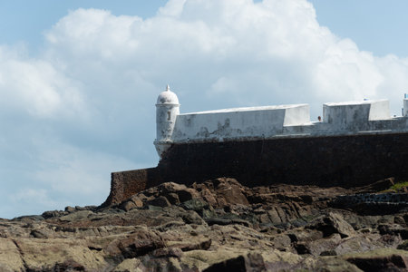 Salvador, Bahia, Brazil - September 01, 2024: Low view of the Santa Maria Fort, during a cloudy day, located in Poorto da Barra in the city of Salvador, Bahia.のeditorial素材