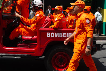 Salvador, Bahia, Brazil - September 07, 2024: Military personnel parade in an old fire department jeep on Brazilian Independence Day in the city of Salvador, Bahia.のeditorial素材