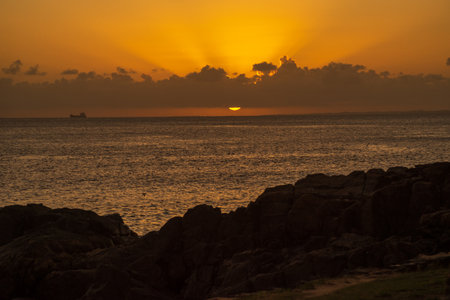 Beautiful dramatic sunset with yellow and orange colors. A spectacle of nature. Preserved environment.の写真素材