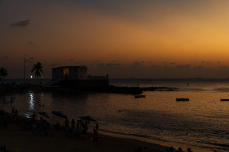 Dramatic sunset view against dark orange clouds. Twilight. Living nature. Salvador, Bahia.の写真素材