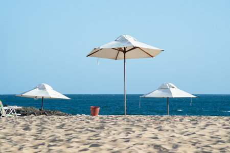 Umbrellas on the beach with blue sky and sea in the background. Vacation concept. fun.の写真素材
