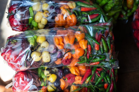Peppers in a plastic bag for sale at a stand. Healthy eatingの写真素材
