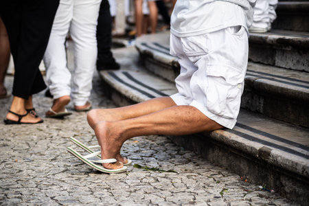 People pray during mass on the last Friday of 2024 at the Bonfim Church, in the city of Salvador,...