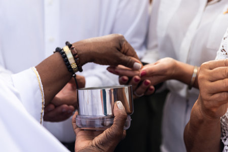 Catholics are seen receiving the host during mass on the last Friday of 2024. Bonfim Church,...