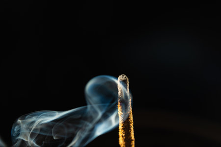 Abstract swirling incense smoke in soft blue tones. Studio shot.の写真素材