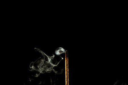 Incense smoke on a dark background for graphic design. Studio shot.の写真素材