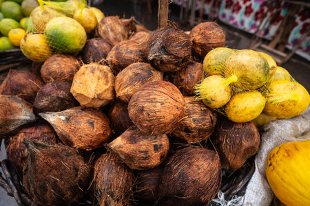 Dried brown coconut for sale at a street market. Source of fiber. Healthy eating. Food sales.の写真素材