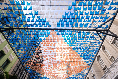 Decorative pennants for the festival of Saint John, colored and hung high up between buildings. June festival in Pelourinho.の写真素材