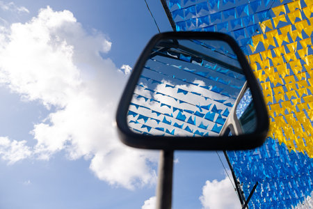 Decoration of the June festival with colorful flags. Plastic objects attached to the top. Pelourinho, Brazil.の写真素材