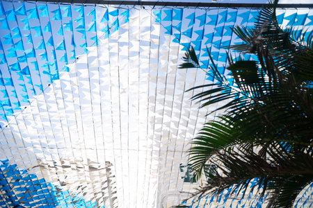 Decorative pennants for the festival of Saint John, colored and hung high up between buildings. June...