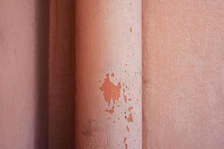Light salmon painted wall. Texture photography. geometric designs