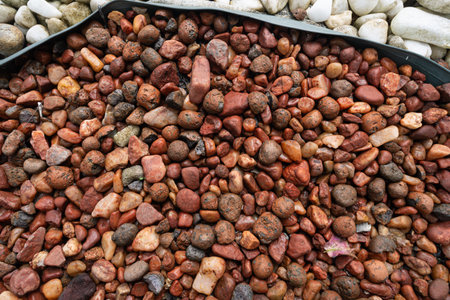 Frame full of decorative brown and white stones. Texture. Background. Geometry.の写真素材