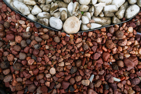 Frame full of decorative brown and white stones. Texture. Background. Geometry.