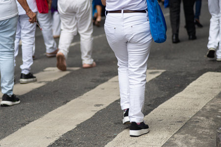 Half-body photo of unidentified people walking on a pedestrian crossing. Salvador, Brazilの写真素材