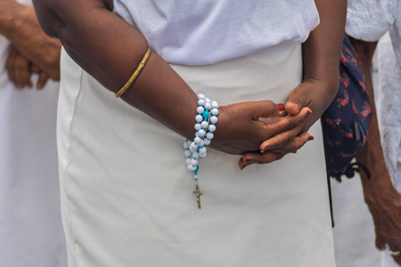 Details of hands of religious person holding crucifix. Salvador, Brazilの写真素材