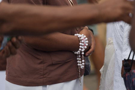Details of hands of religious person holding crucifix. Salvador, Brazilの写真素材