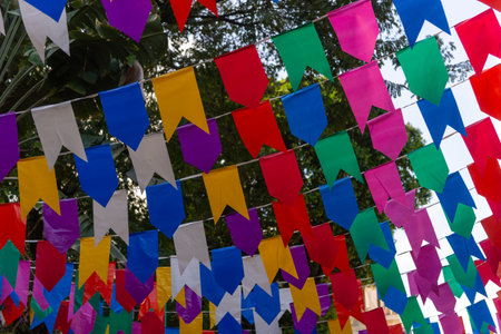 Colorful plastic pennants for decoration against a blue sky. Decorative objects.の写真素材
