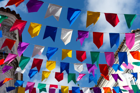 Colorful plastic pennants for decoration against a blue sky. Decorative objects.の写真素材
