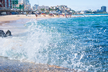 splashes of a beach wave crashing hard against a cement pier. Winter season. Force of nature.