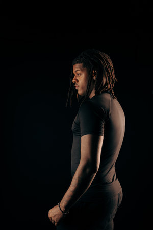 Salvador, Bahia, Brazil - August 30, 2025: Handsome man with dreadlocks wearing black clothing...