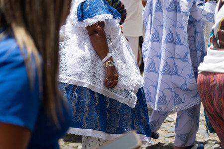 Salvador, Bahia, Brazil - November 25, 2025: Rear view of a group of Bahian women selling acaraje celebrating in the streets of Salvador, Bahia, in honor of their day.のeditorial素材