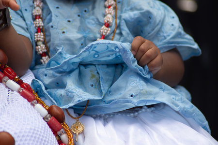 Salvador, Bahia, Brazil - November 25, 2025: Details of the body and clothing of the Baianas do Acaraje participating in their day in Pelourinho, Salvador, Bahia.のeditorial素材