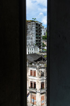 Salvador, Bahia, Brazil - August 13, 2025: View of old and abandoned urban buildings in the ComÃ©rcio neighborhood in Salvador, Bahia.のeditorial素材