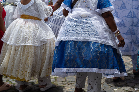Salvador, Bahia, Brazil - November 25, 2025: Rear view of a group of Bahian women selling acaraje celebrating in the streets of Salvador, Bahia, in honor of their day.のeditorial素材