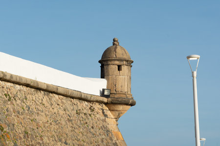 Salvador, Bahia, Brazil - December 12, 2025: View of the stone guardhouse of the Barra Lighthouse in...