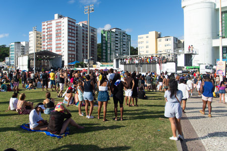 Salvador, Bahia, Brazil - September 14, 2025: A large crowd of people is seen during the LGBTQIA+ Pride Parade in Salvador, Bahia, with a stage in the background and urban buildings.のeditorial素材