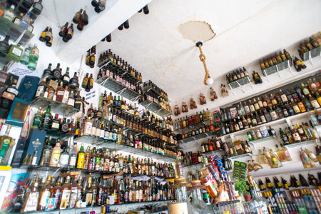 Salvador, Bahia, Brazil - December 8, 2025: View of shelves filled with bottles of alcoholic beverages in the Cachaca Museum. City of Salvador, Bahia.のeditorial素材