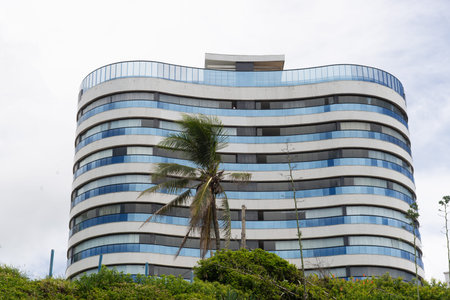 Salvador, Bahia, Brazil - January 23, 2026: Detail of a building with light-colored balconies...