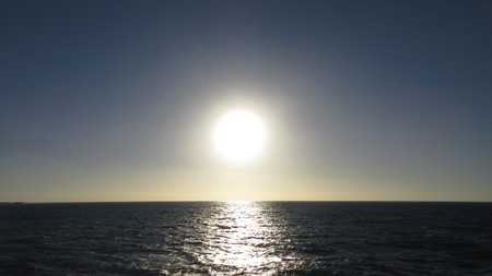 Sun Setting over the Oceanの写真素材