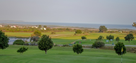 View over a golf course to the oceanの写真素材