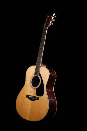 Acoustic Guitar with a dark backgroundの写真素材