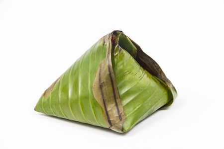 Single pack of simple and authentic nasi lemak wrapped in banana leaf.の写真素材