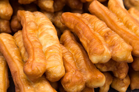 Fried bread stick or popularly known as You Tiao, a popular Chinese cuisineの写真素材