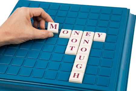 Board game concept with the letters Money Not Enoughの写真素材