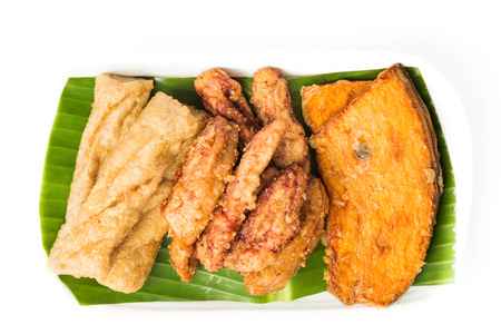 A serving consisting of the combination of fried banana (pisang goreng), fried sweet potatoes (keledek goreng) and fish nuggets (keropok lekor), a popular snack in Malaysiaの写真素材