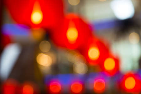 Blurry and Bokeh Background consisting red lanterns and lightsの写真素材